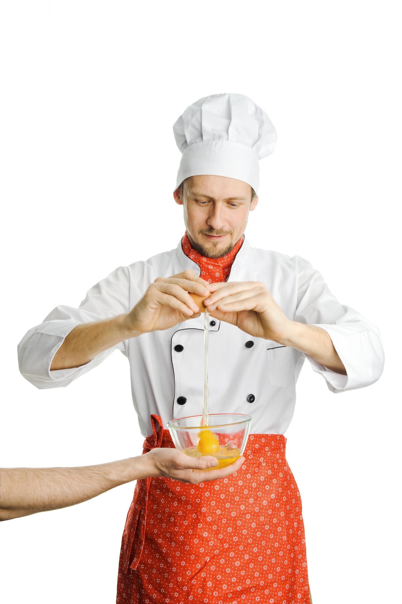 Chef demonstrating technique in a bright kitchen
